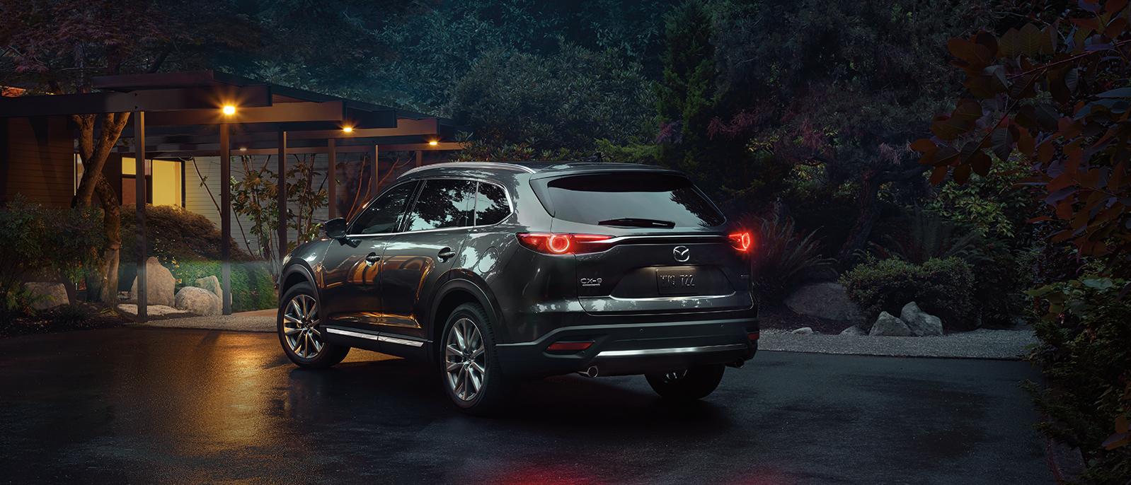 2020 Mazda CX-9 parked in front of a country house. 2020 Mazda CX-9 parked in front of a country house.