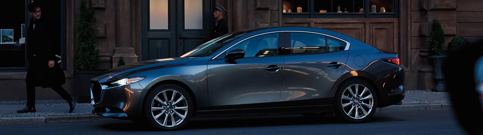 A 2022 Mazda 3 Sedan parked in the streets.