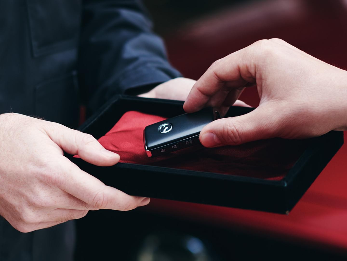 Customer Taking Vehicle Remote from Box