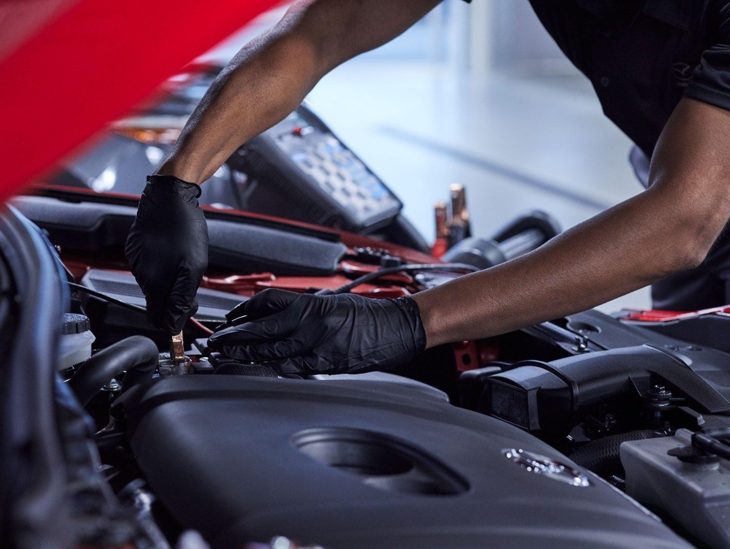 Service Technician Installing Battery