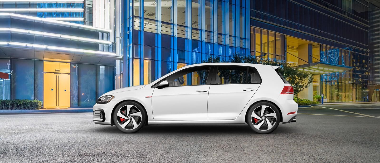 A 2020 White Volkswagen Golf GTI Parked in front of a building