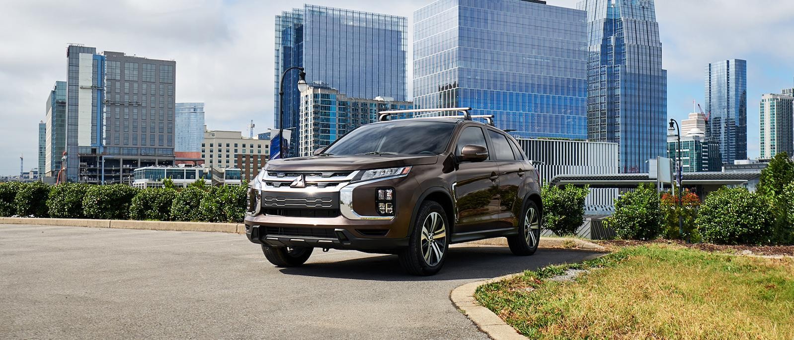A 2021 Mitsubishi Outlander riding through suburb