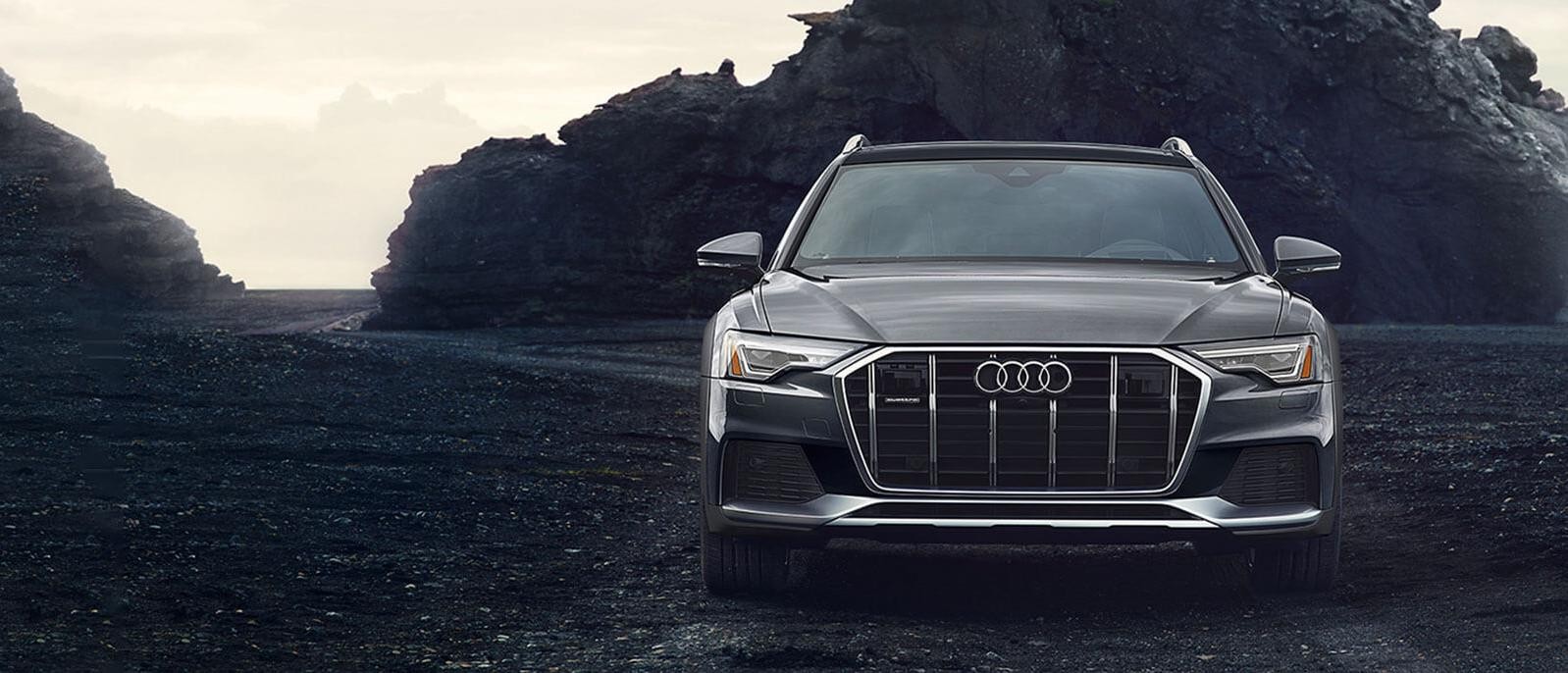 2020 Grey Audi A6 allroad Parked in front of the mountain