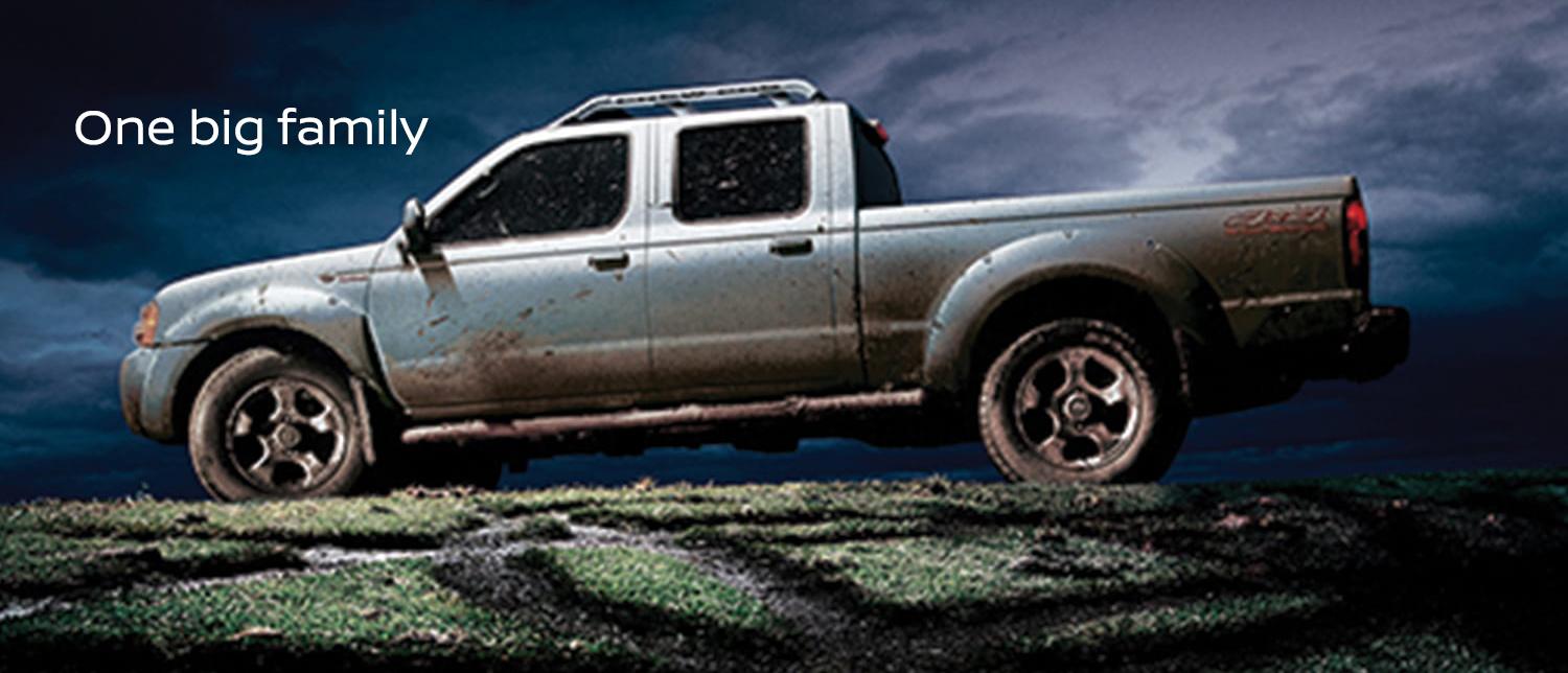 Muddied Nissan Frontier side view.jpg