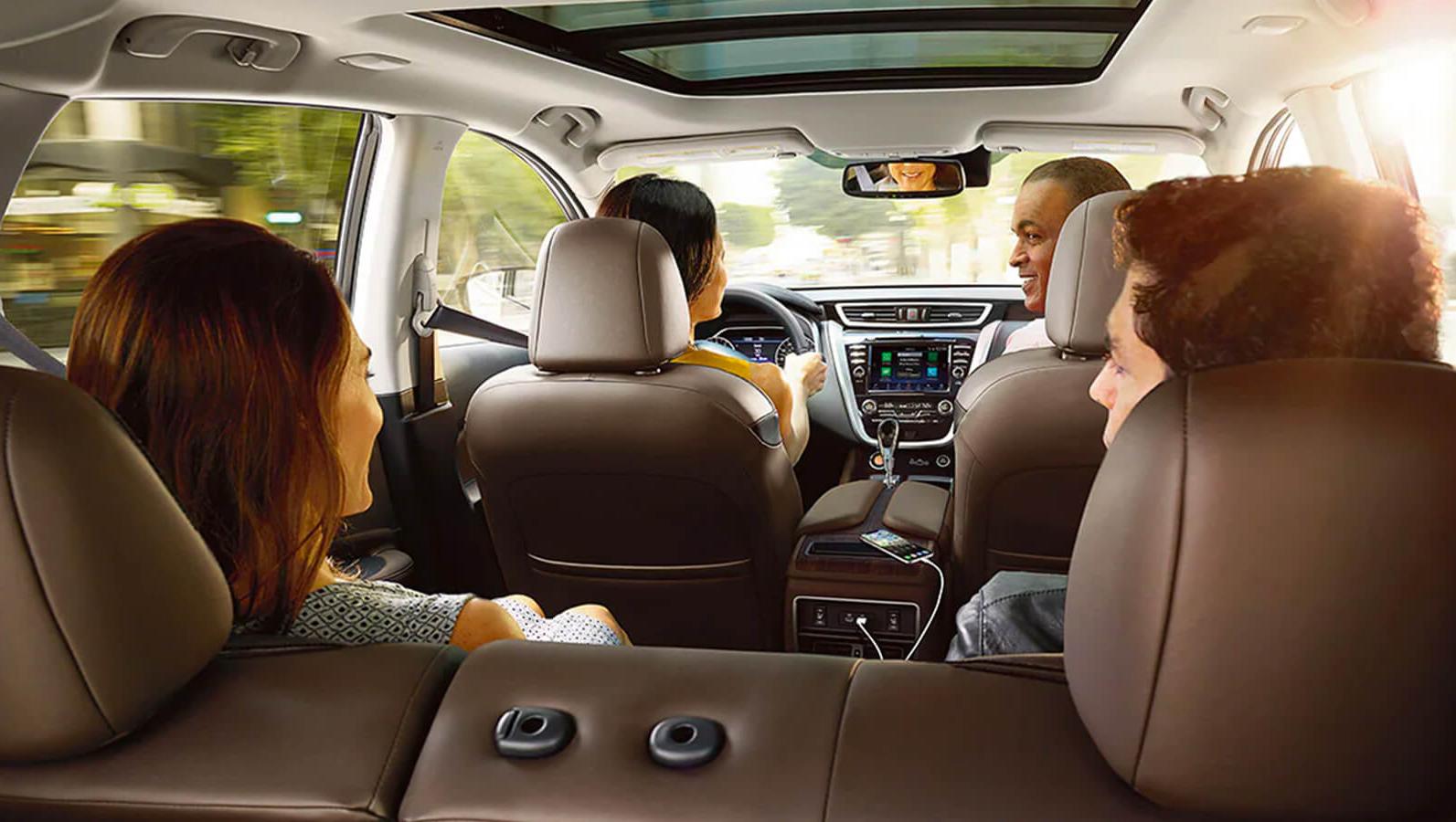 People sitting inside Nissan Murano People sitting inside Nissan Murano