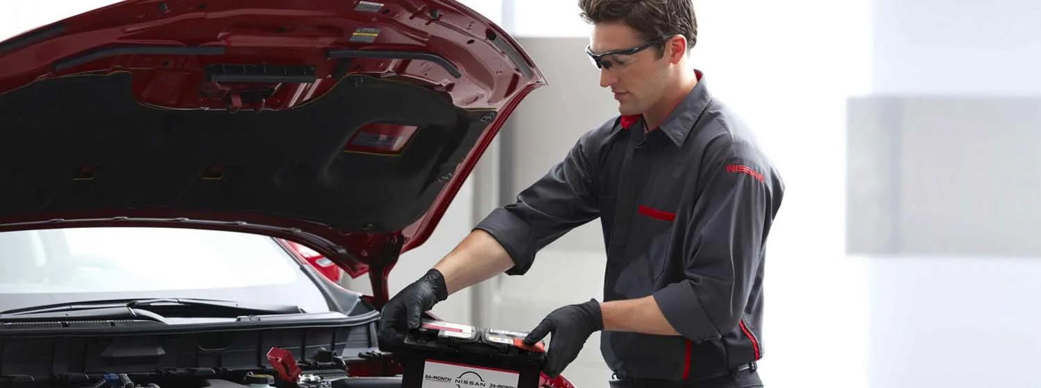Service advisor checking battery