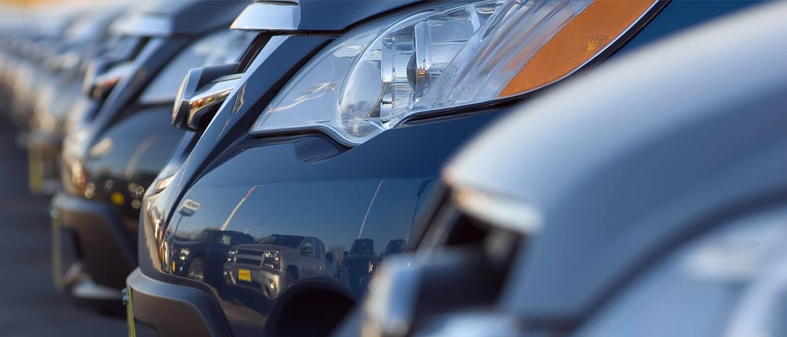 Vehicles parked on a dealership sales lot