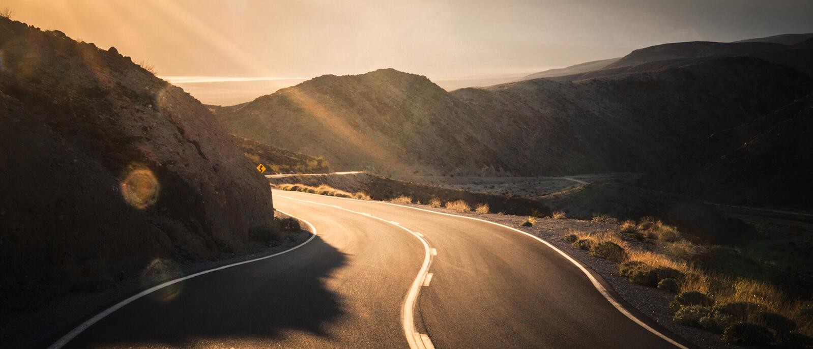 Sunlit mountain road