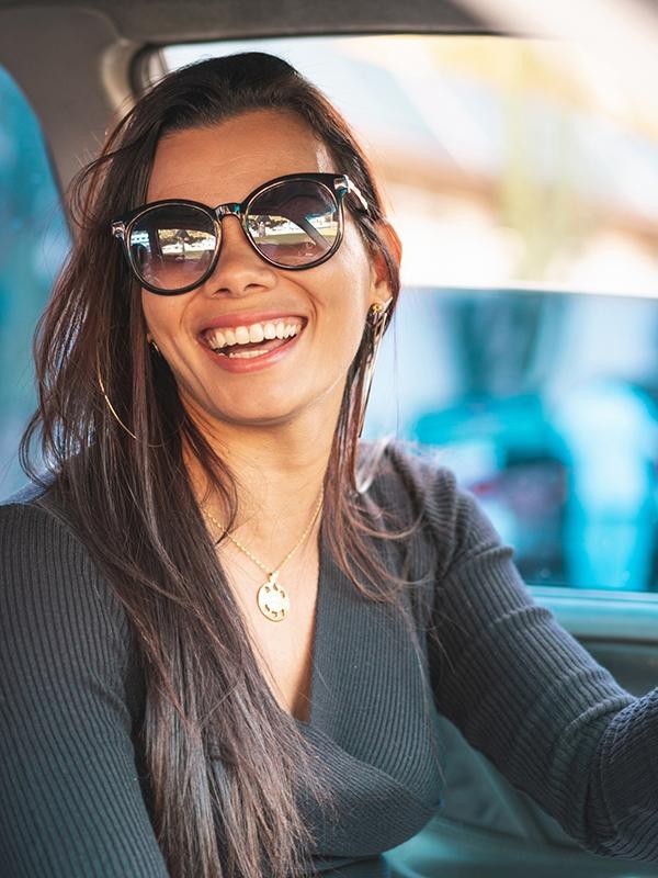 Smiling woman sitting in a car