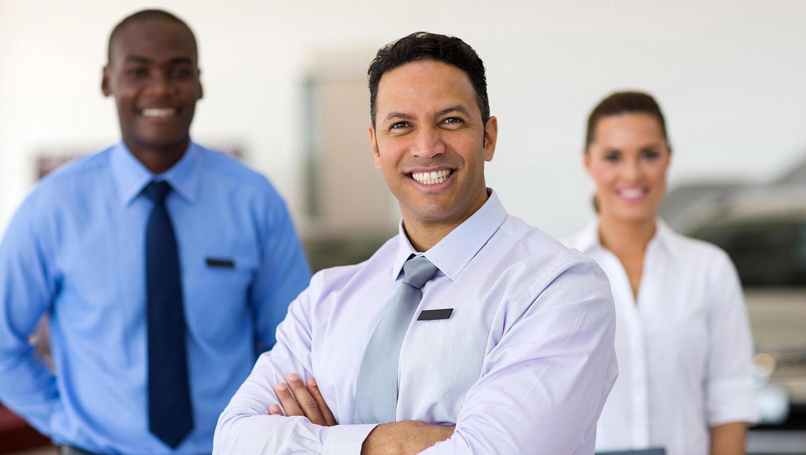 Smiling dealership associates Smiling dealership associates