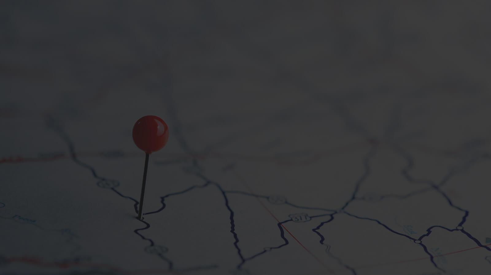 Road map with a pin marking a location