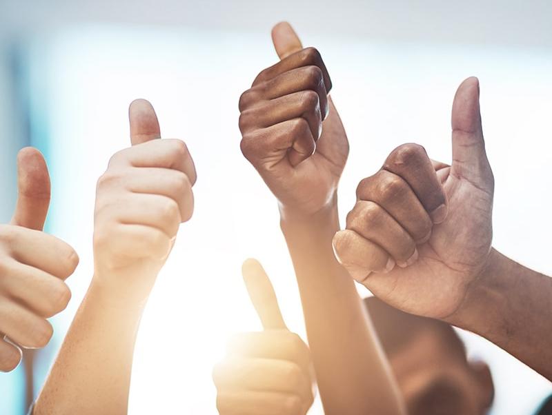People giving a thumbs up signal