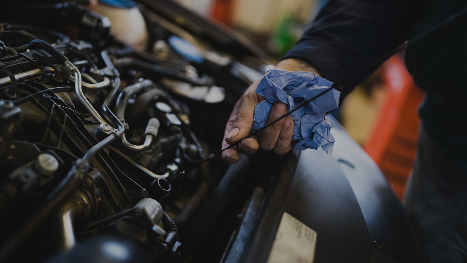Mechanic checking an engine's oil