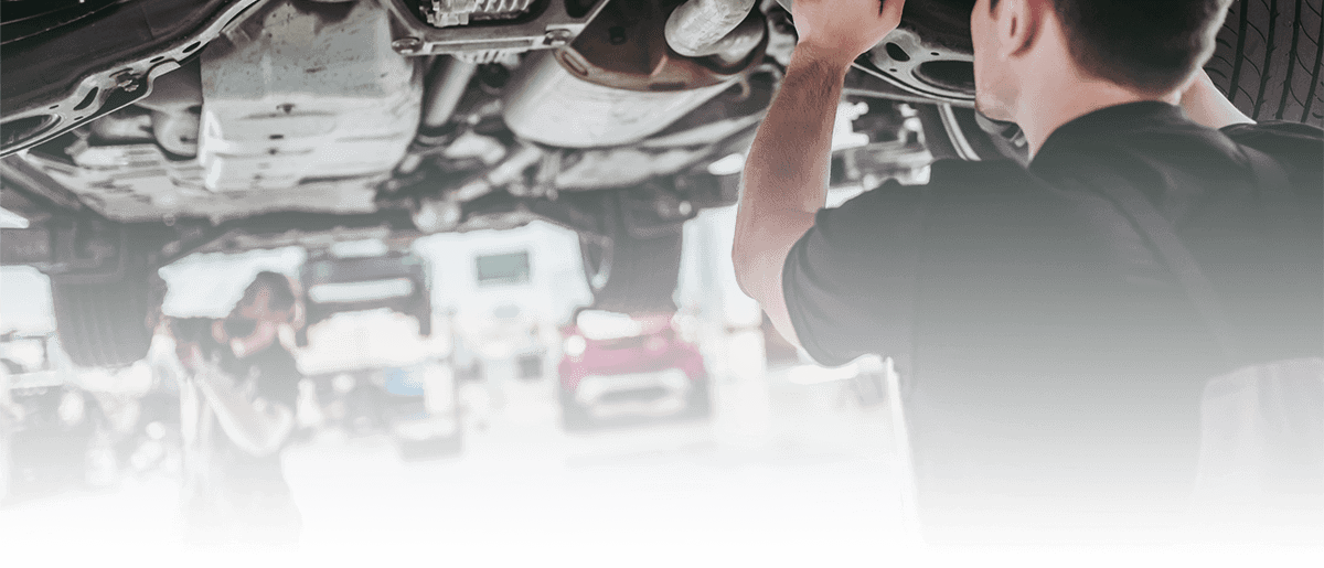 Service mechanics working on a vehicle