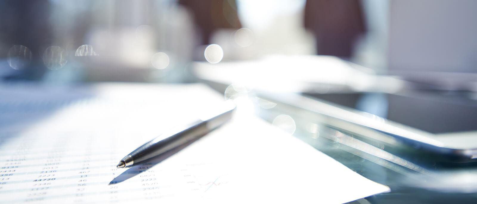 Finance documents on a desk Finance documents on a desk