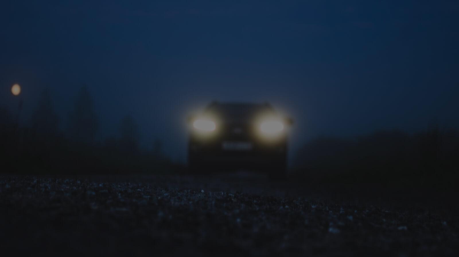Headlights of a car in the dark