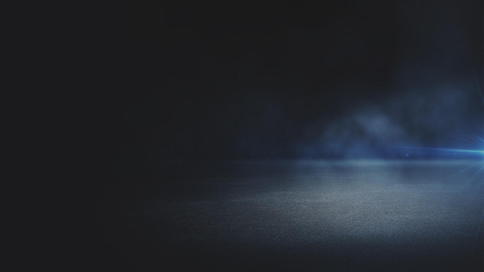 Hazy fog on dimly lit pavement