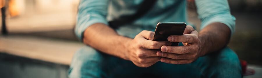 Man looking at a smart phone