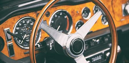 Interior view of the driver's side of a vintage car