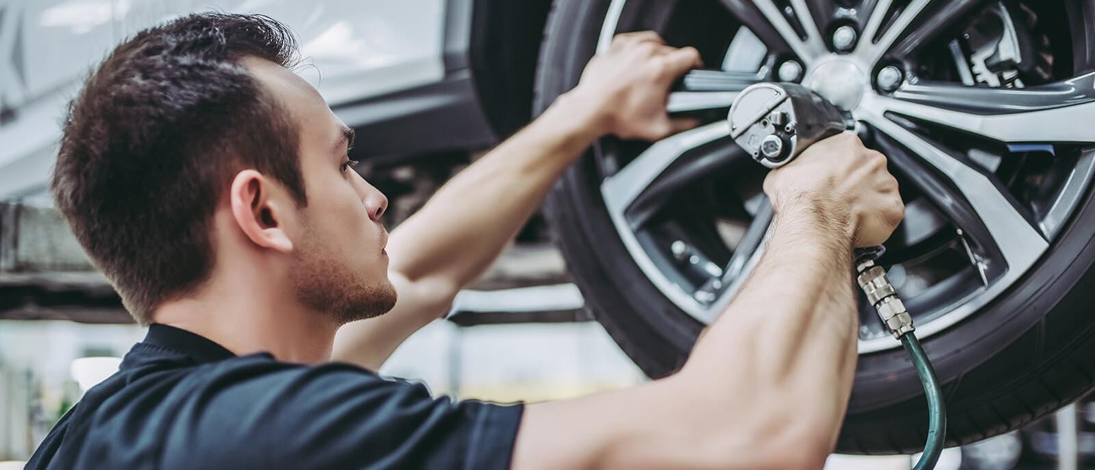 Mechanic fixing a tire