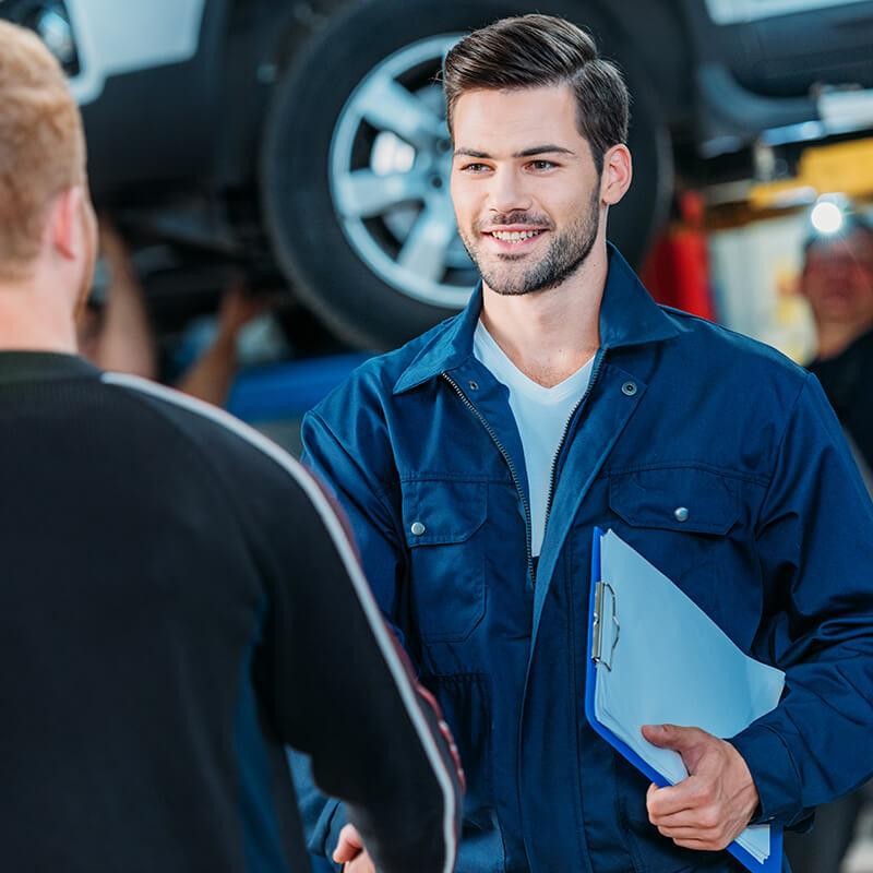 Mechanic shaking hands with a customer