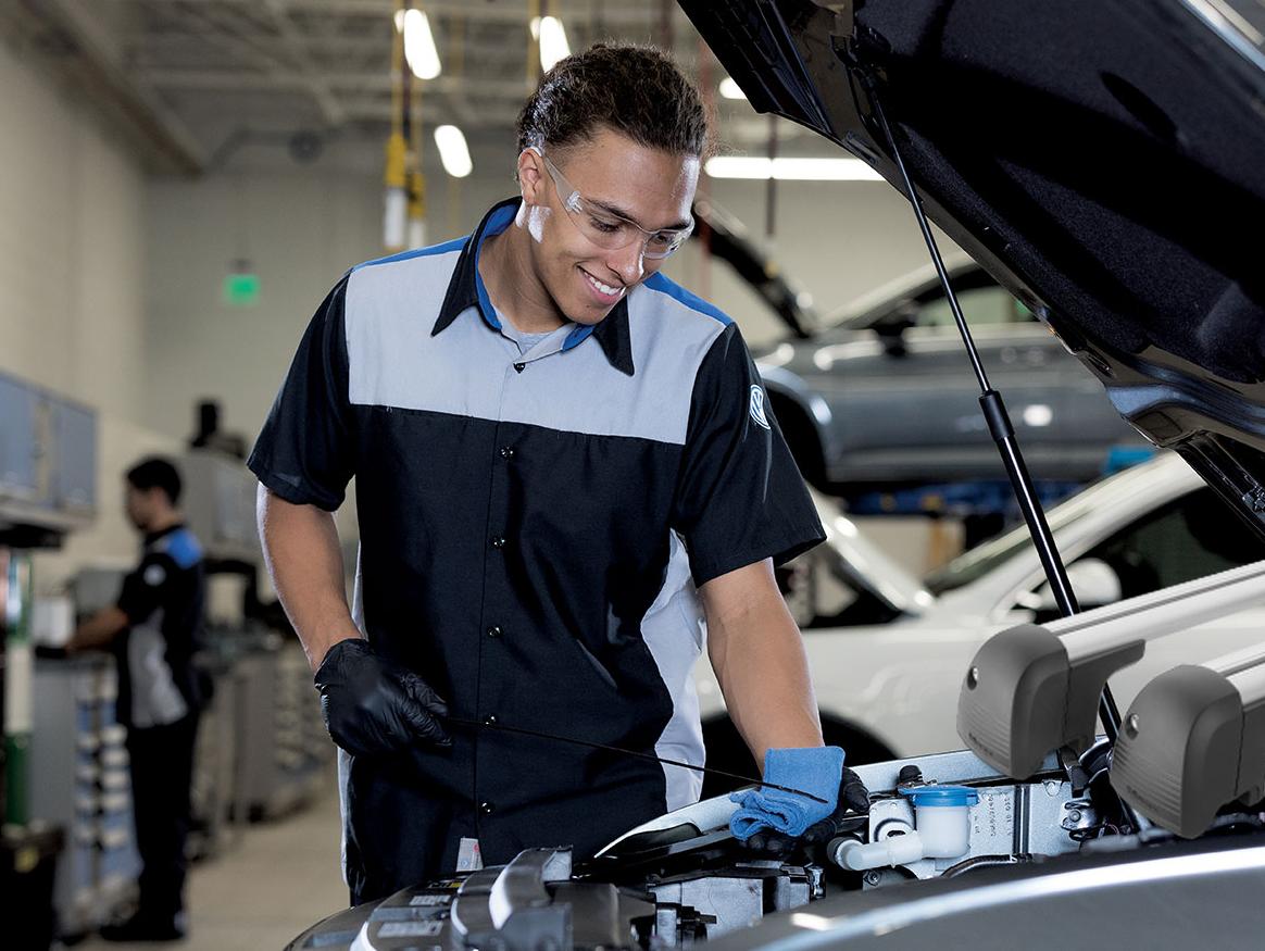 Service Tech checking oil