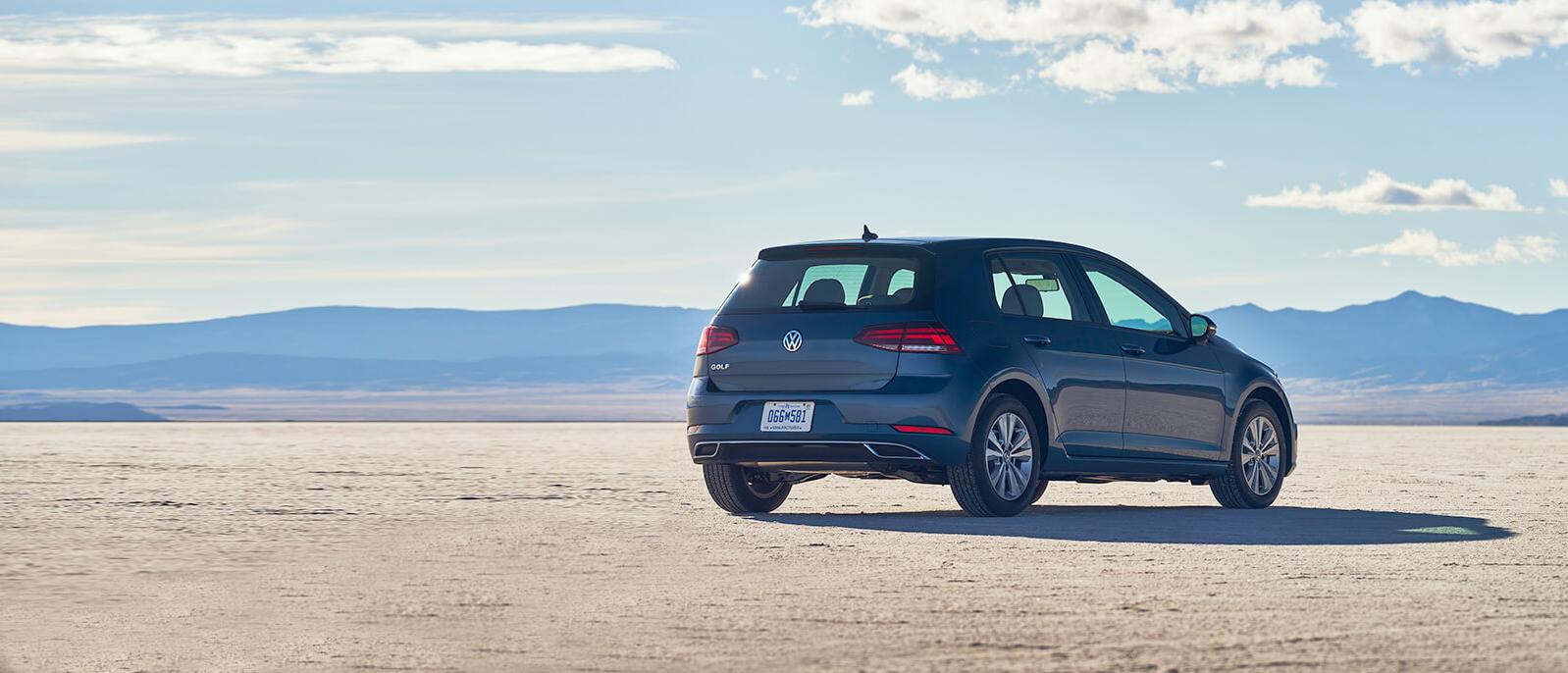 A Blue Golf in front of mountain A Blue Golf in front of mountain