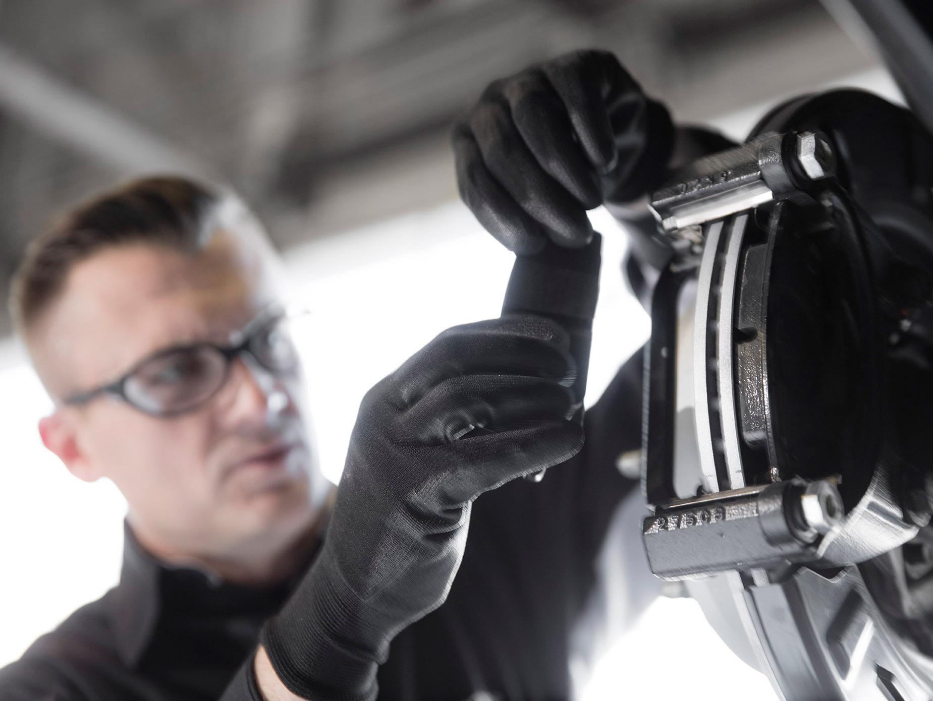 GMC Tech Fixing Brakes GMC Tech Fixing Brakes