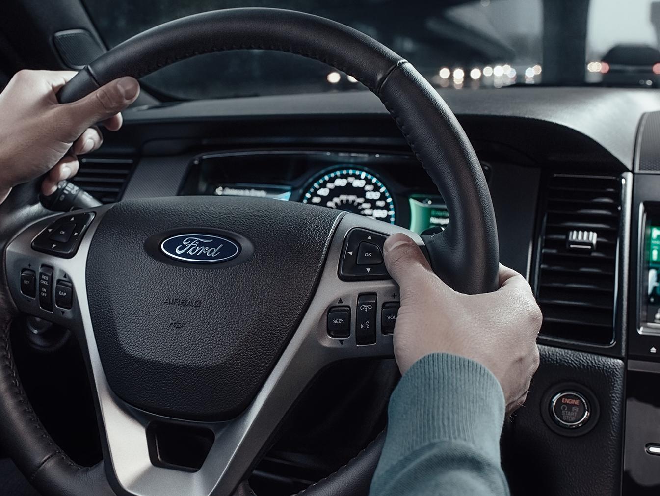 2018 Taurus Steering wheel with hands on the wheel