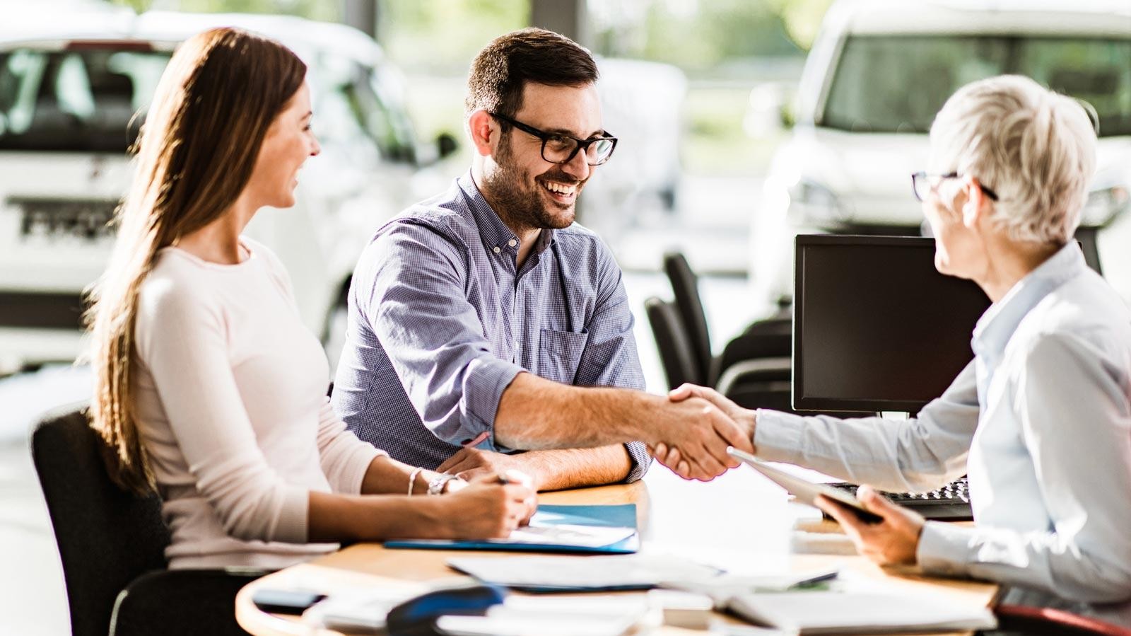 Couple finalizing car finance