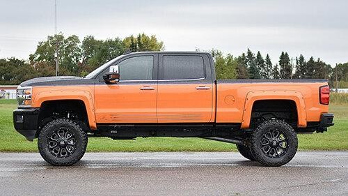 Big lifted orange and black truck