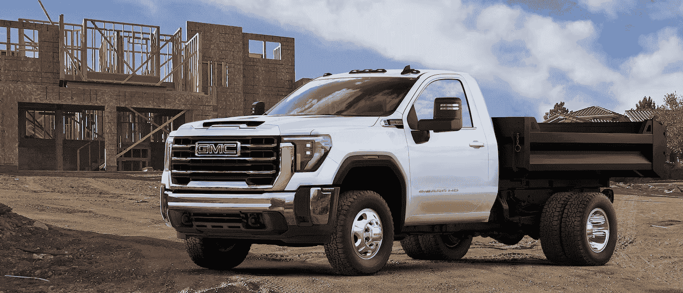 A GMC Work truck sits parked at a job site.