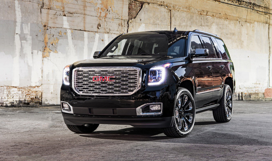 Black 2020 GMC Yukon parked under a bridge