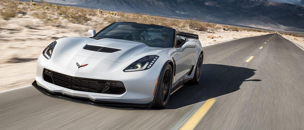 2018 Corvette Stingray driving on a desert road.