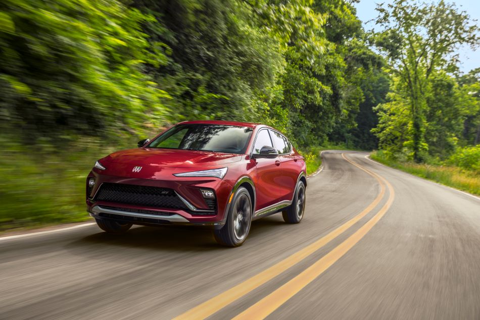 A 2024 Buick Envista is driving on a curvy road.