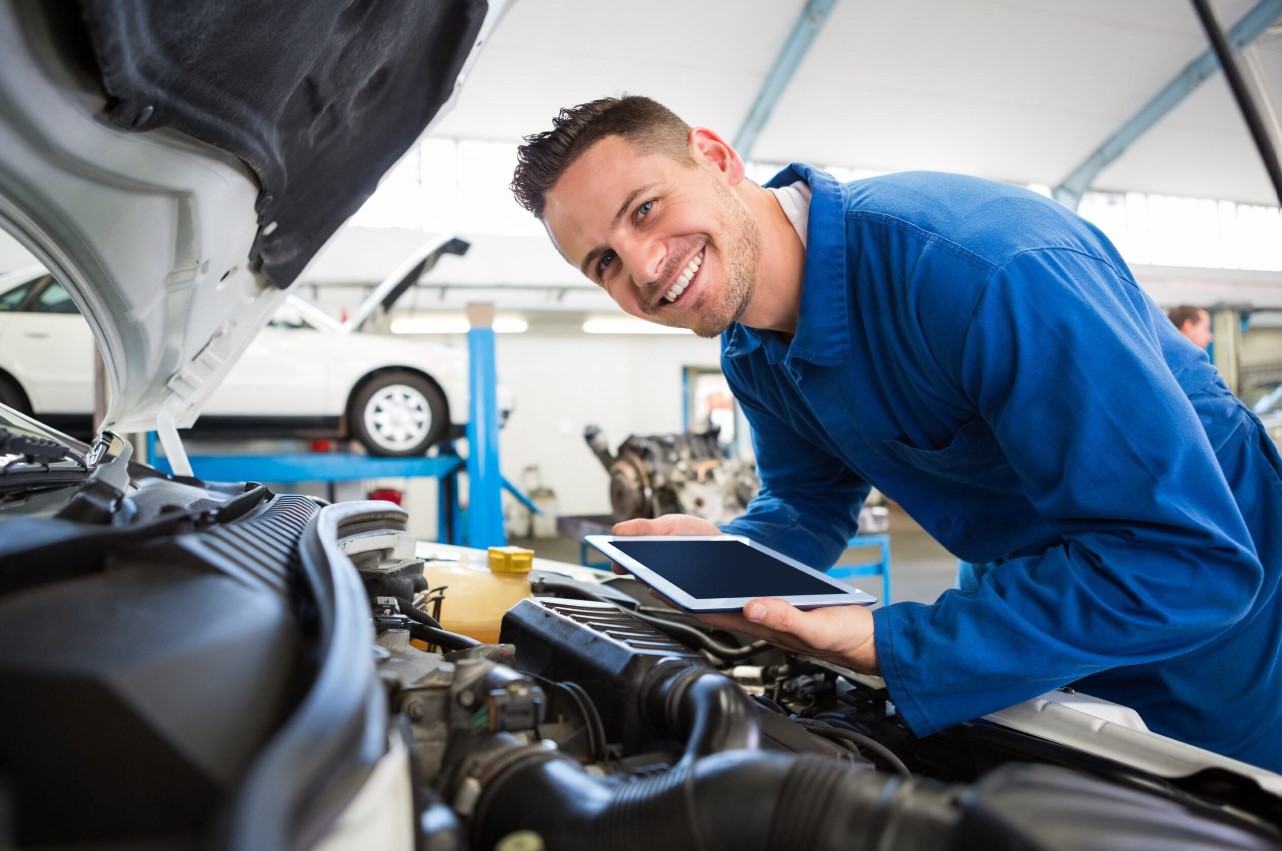 Mechanic checking an engine's oil