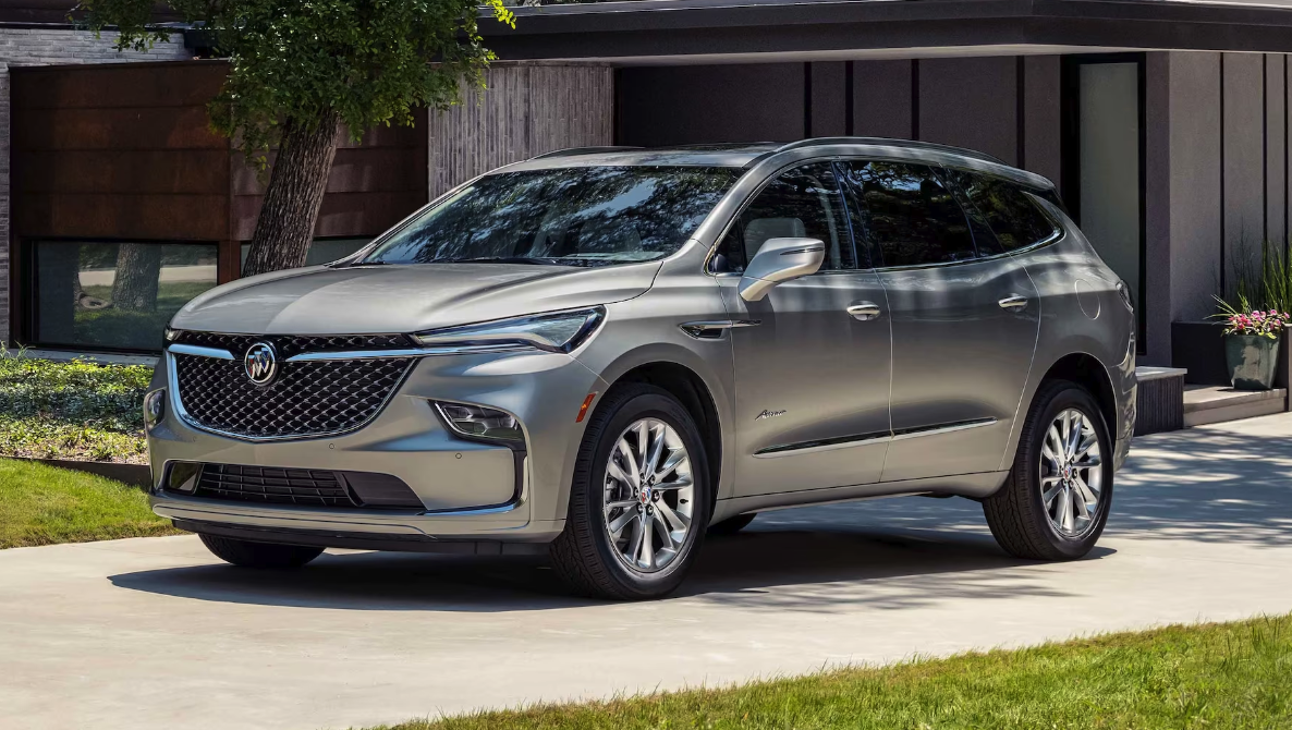 Angled photo of 2024 Buick Enclave parked in front of a house Angled photo of 2024 Buick Enclave parked in front of a house