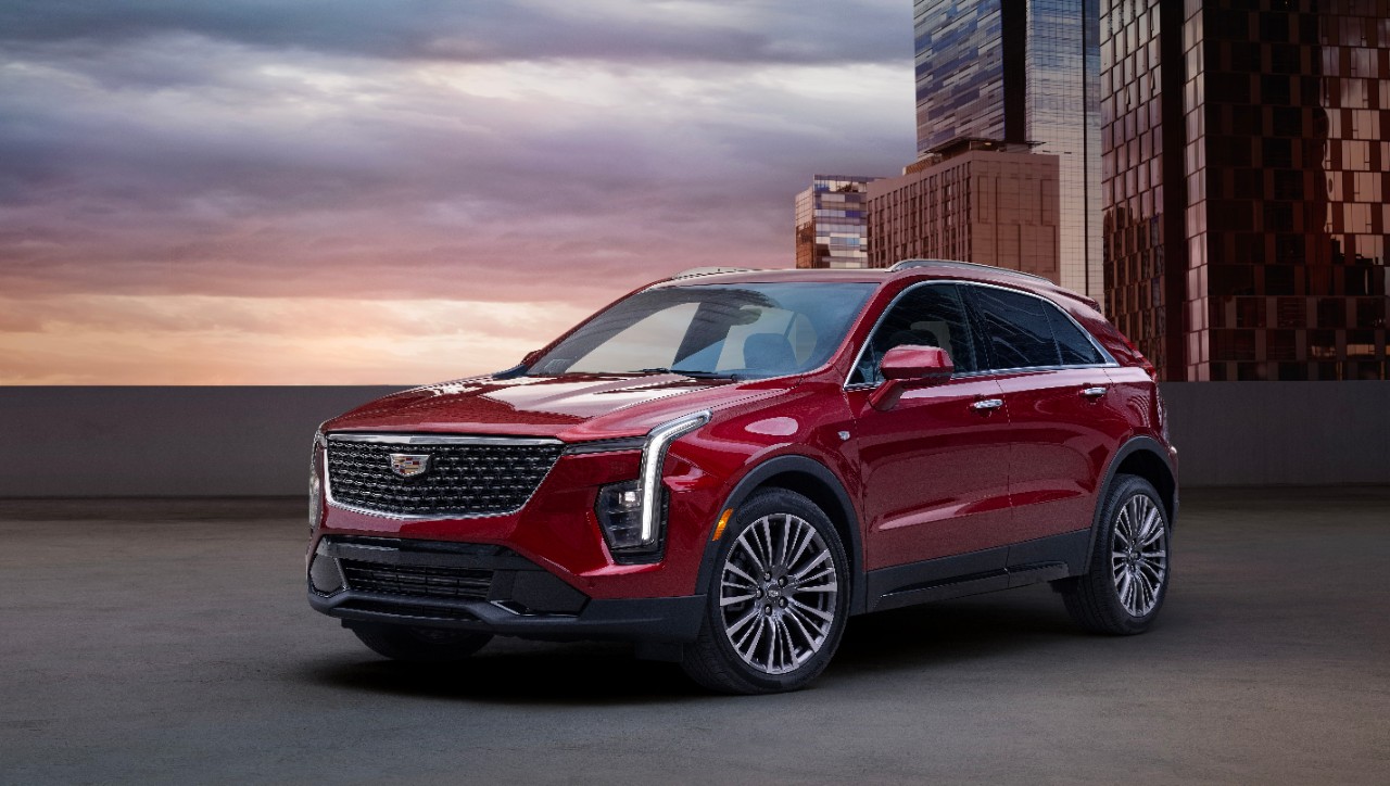 A red Cadillac XT4 is parked.