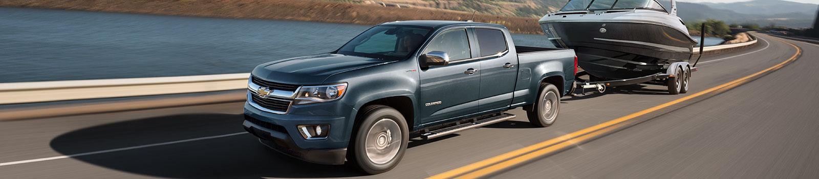 2019 Chevy Colorado driving by lake and towing boat 2019 Chevy Colorado driving by lake and towing boat