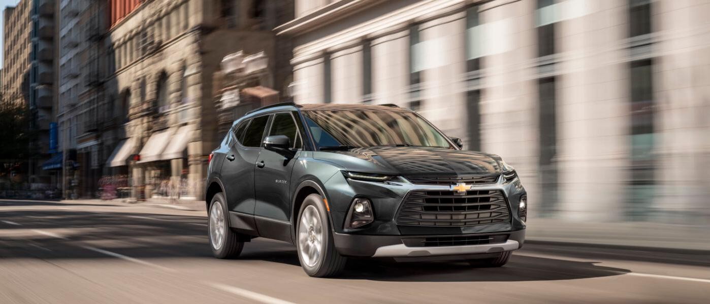 2019 Green Chevy Blazer Driving Down City Street Motion Blurr 2019 Green Chevy Blazer Driving Down City Street Motion Blurr