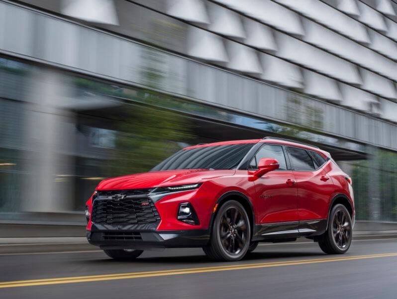 2019 Red Chevrolet Blazer Driving Past a Building 2019 Red Chevrolet Blazer Driving Past a Building