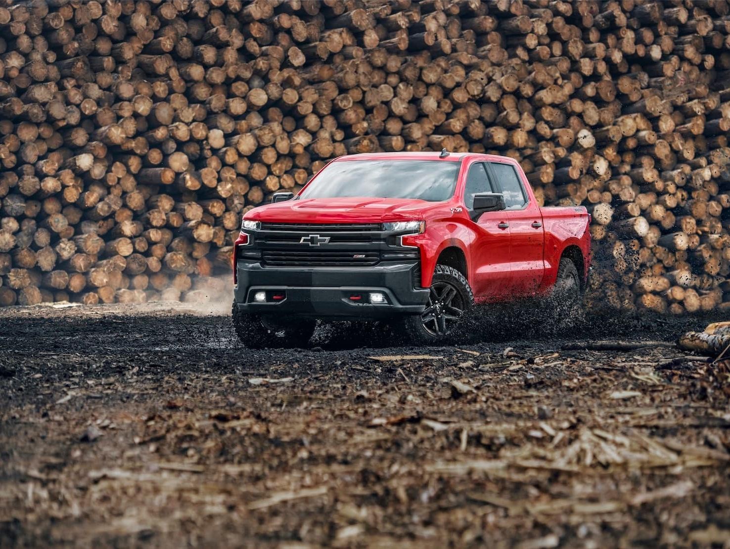 Red 2019 Chevy Silverado 1500 Driving Through Mud Red 2019 Chevy Silverado 1500 Driving Through Mud