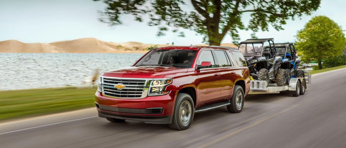2019 Red Chevy Tahoe Towing ATVs 2019 Red Chevy Tahoe Towing ATVs