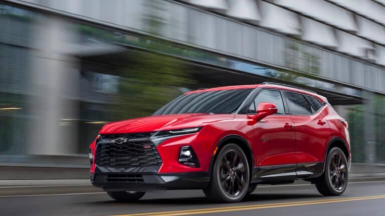 2019 Red Chevy Blazer RS Driving Past a Building 2019 Red Chevy Blazer RS Driving Past a Building