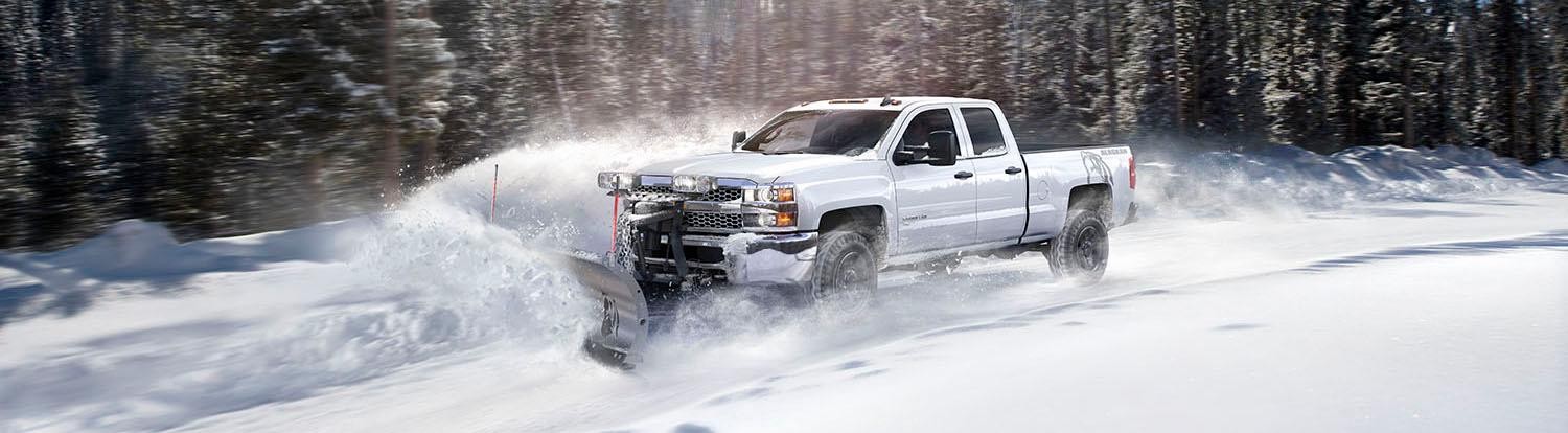 2019 Chevy Silverado 2500HD in Summit White Plowing Snow