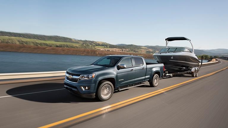 2019 Blue Chevy Colorado Towing a Boat Past Water 2019 Blue Chevy Colorado Towing a Boat Past Water