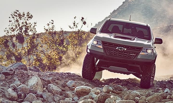 2019 Green Chevy Colorado Driving Down Hill on Rocks 2019 Green Chevy Colorado Driving Down Hill on Rocks