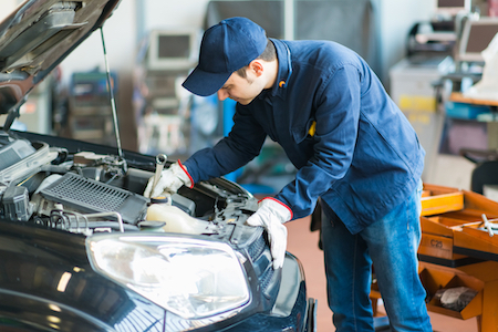 Mechanic working on car