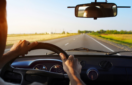 man driving a car