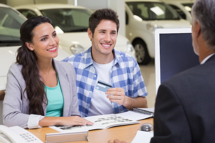 Caucasian couple applying for car loan